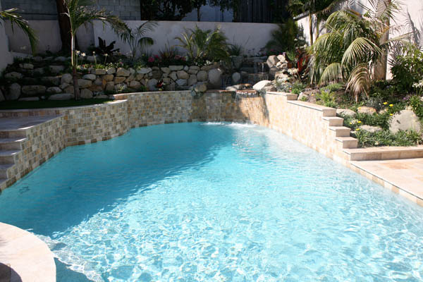 Freeform in-ground swimming pool with water feature swimming pool in-ground water feature