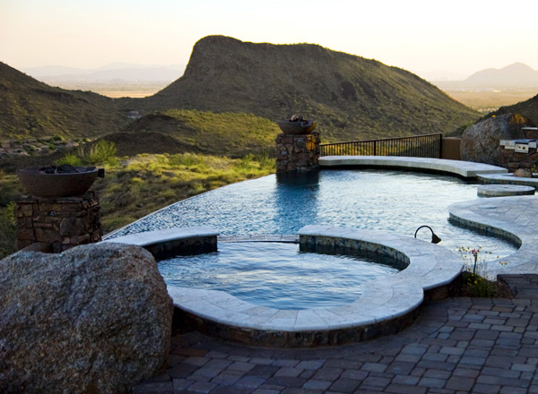 Freeform infinity pool with torch posts infinity swimming pool freeform torch posts hills