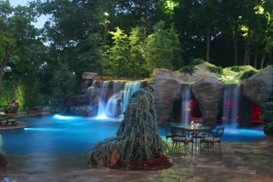 Pool with Rock Waterfall and Lights by https://www.flickr.com/photos/cavinesslandscape/7065360801